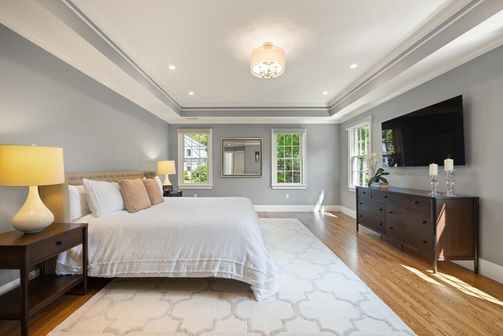 23 Richard Road Lexington, MA 02421 - Photo 15 of 42 a bedroom with a bed and a flat screen television