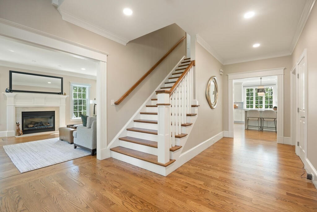 23 Richard Road Lexington, MA 02421 - Photo 2 of 42 a view of an empty room with wooden floor fireplace and a window
