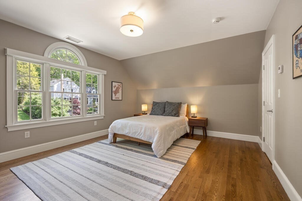 23 Richard Road Lexington, MA 02421 - Photo 22 of 42 a bedroom with a bed and a window