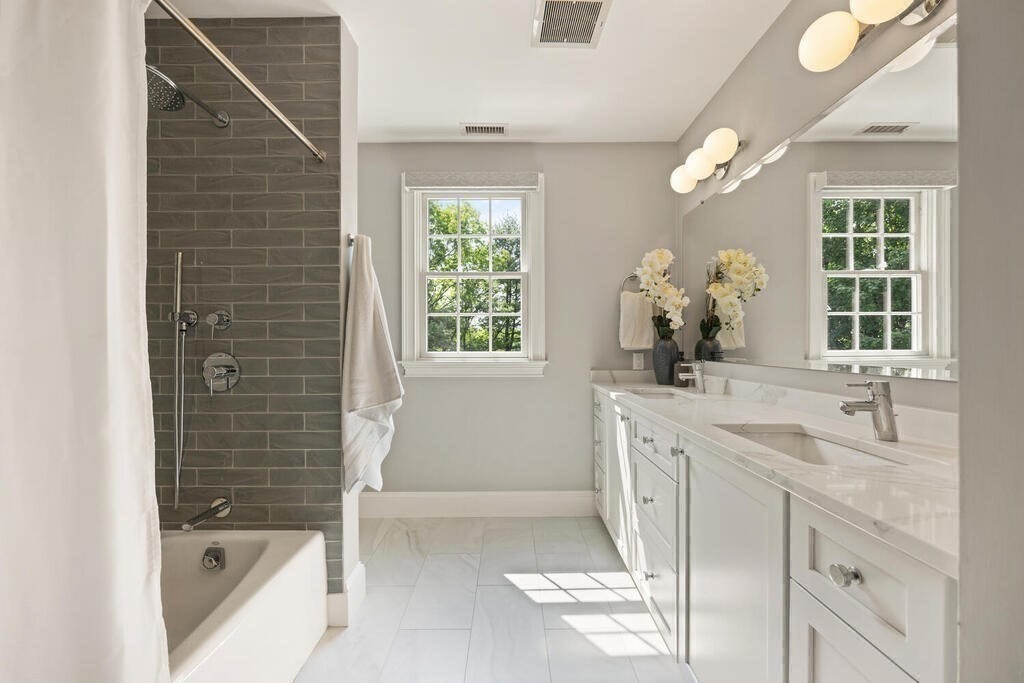 23 Richard Road Lexington, MA 02421 - Photo 23 of 42 a bathroom with a granite countertop sink a toilet and shower