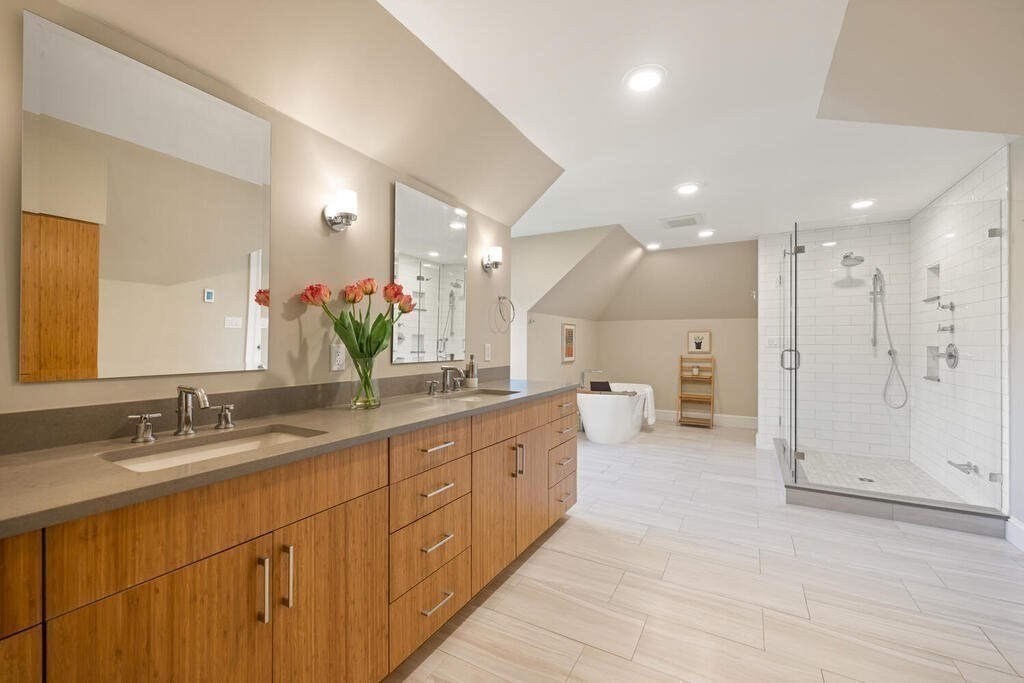 23 Richard Road Lexington, MA 02421 - Photo 27 of 42 a spacious bathroom with a double vanity sink mirror and shower