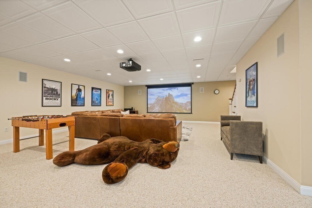 23 Richard Road Lexington, MA 02421 - Photo 28 of 42 a living room with furniture and a flat screen tv