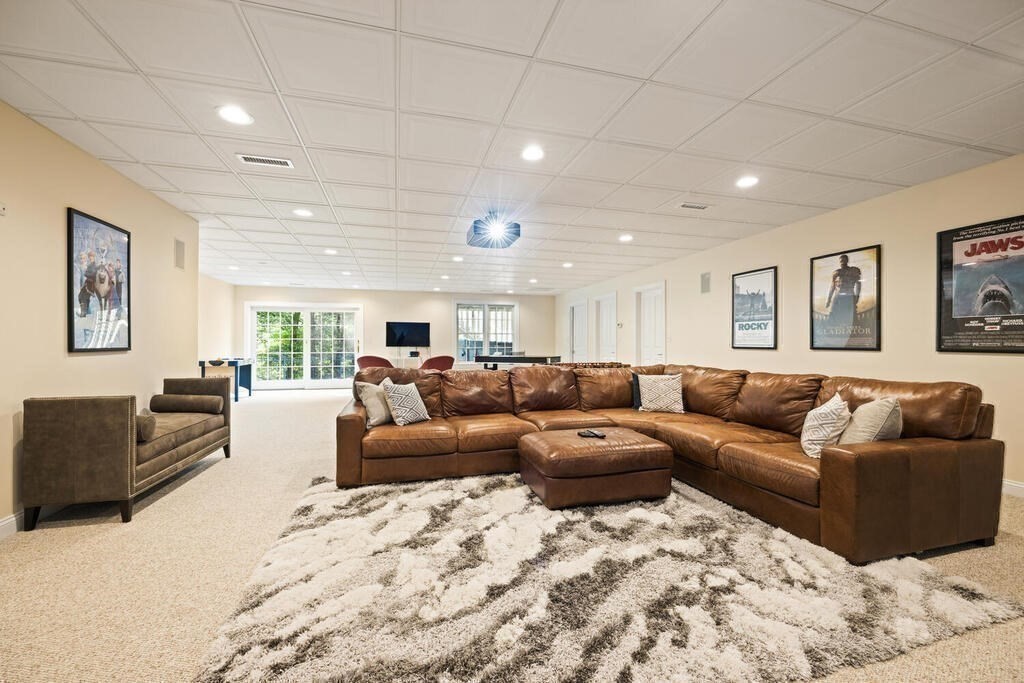 23 Richard Road Lexington, MA 02421 - Photo 29 of 42 a living room with furniture and a couch