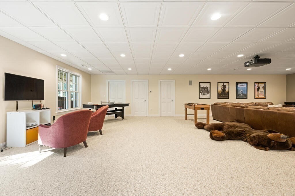 23 Richard Road Lexington, MA 02421 - Photo 30 of 42 a living room with furniture and a flat screen tv