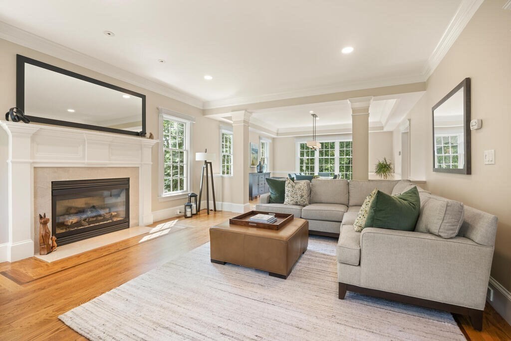 23 Richard Road Lexington, MA 02421 - Photo 3 of 42 a living room with furniture and a fireplace