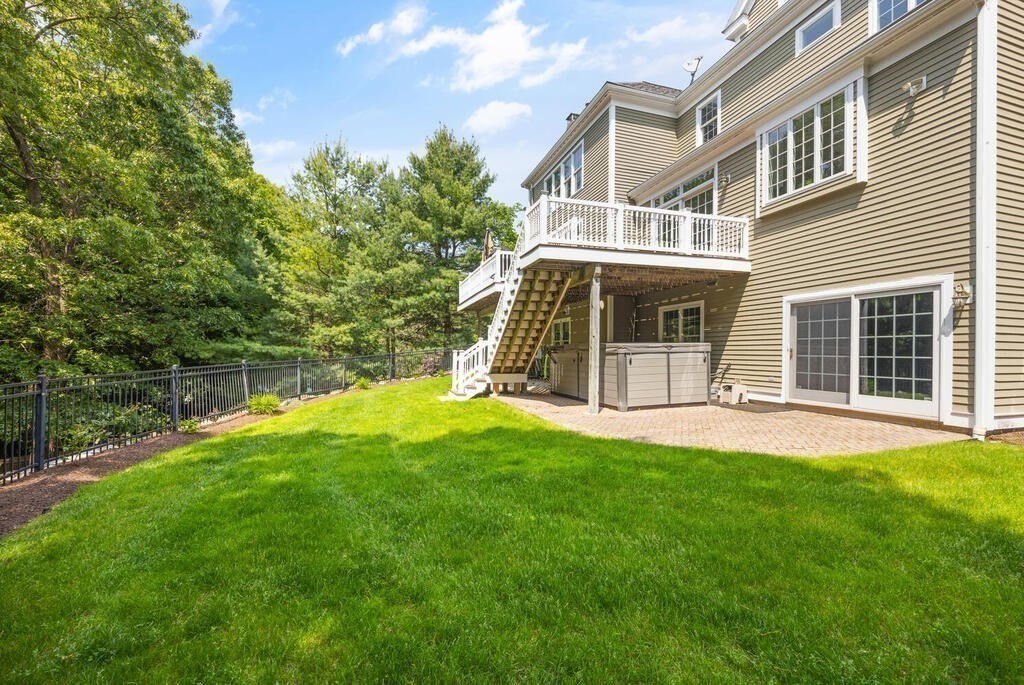 23 Richard Road Lexington, MA 02421 - Photo 34 of 42 a view of a house with a yard and a garden