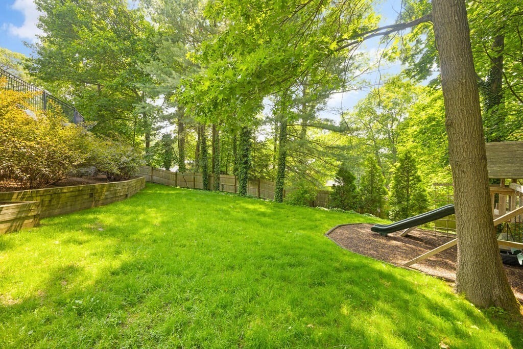 23 Richard Road Lexington, MA 02421 - Photo 36 of 42 a view of a backyard with large trees