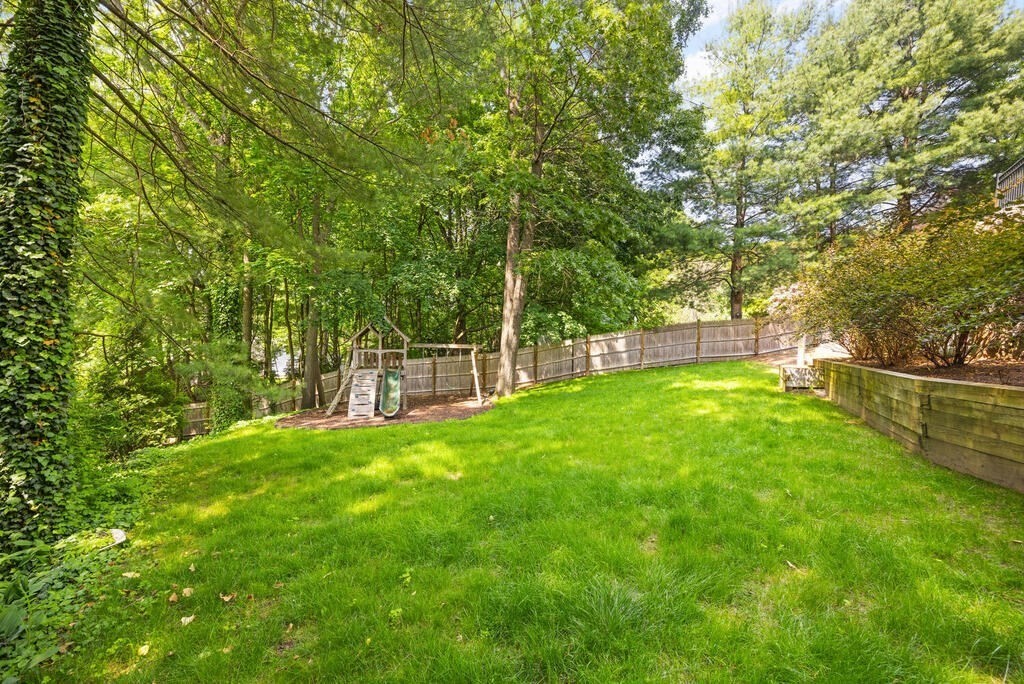 23 Richard Road Lexington, MA 02421 - Photo 37 of 42 a view of a yard with a large tree