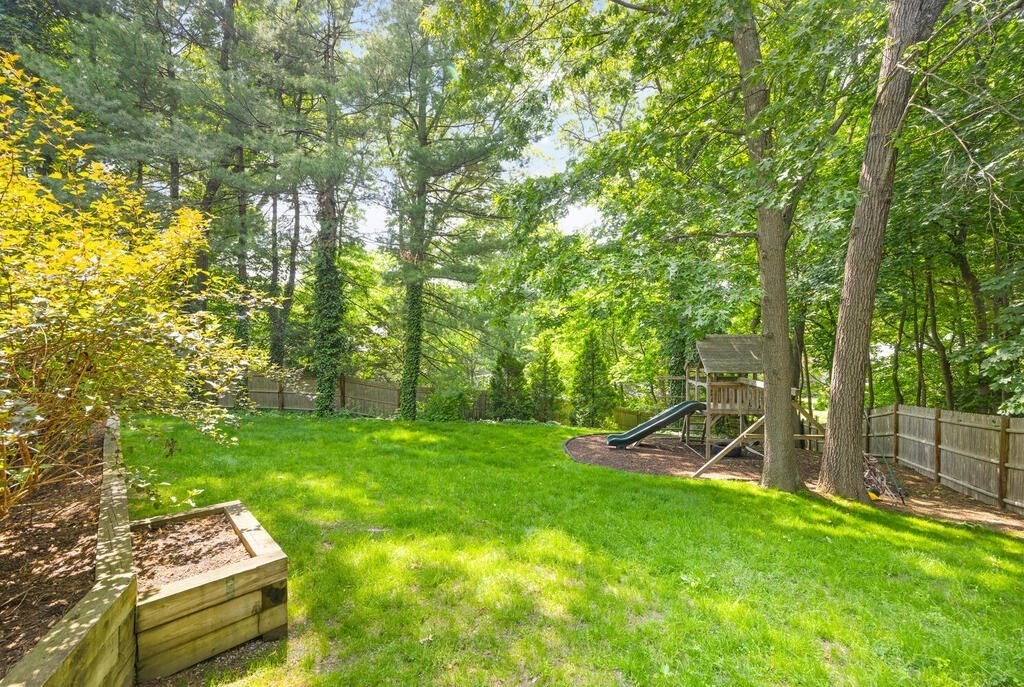 23 Richard Road Lexington, MA 02421 - Photo 38 of 42 a backyard of a house with chairs and a table