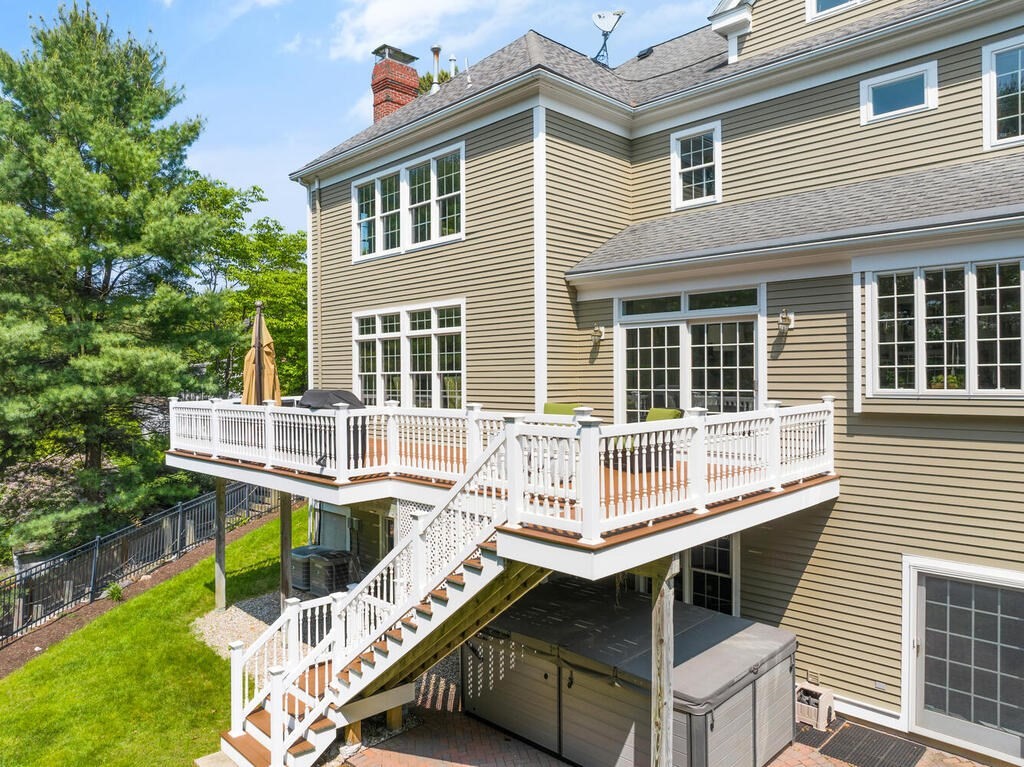 23 Richard Road Lexington, MA 02421 - Photo 40 of 42 a balcony with table and chairs
