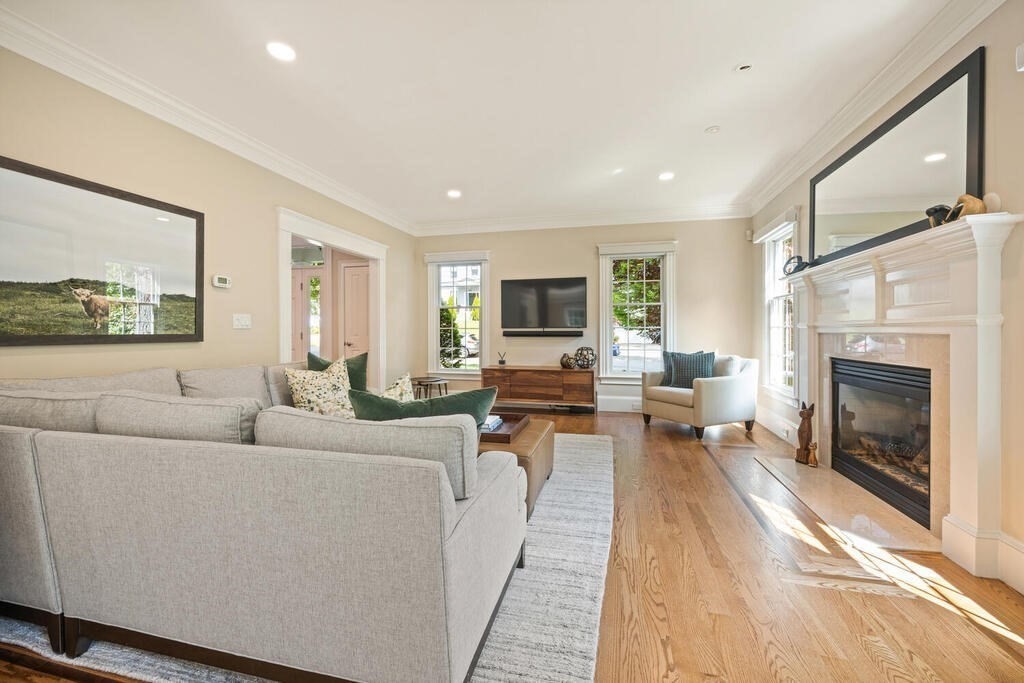 23 Richard Road Lexington, MA 02421 - Photo 4 of 42 a living room with furniture and a fireplace