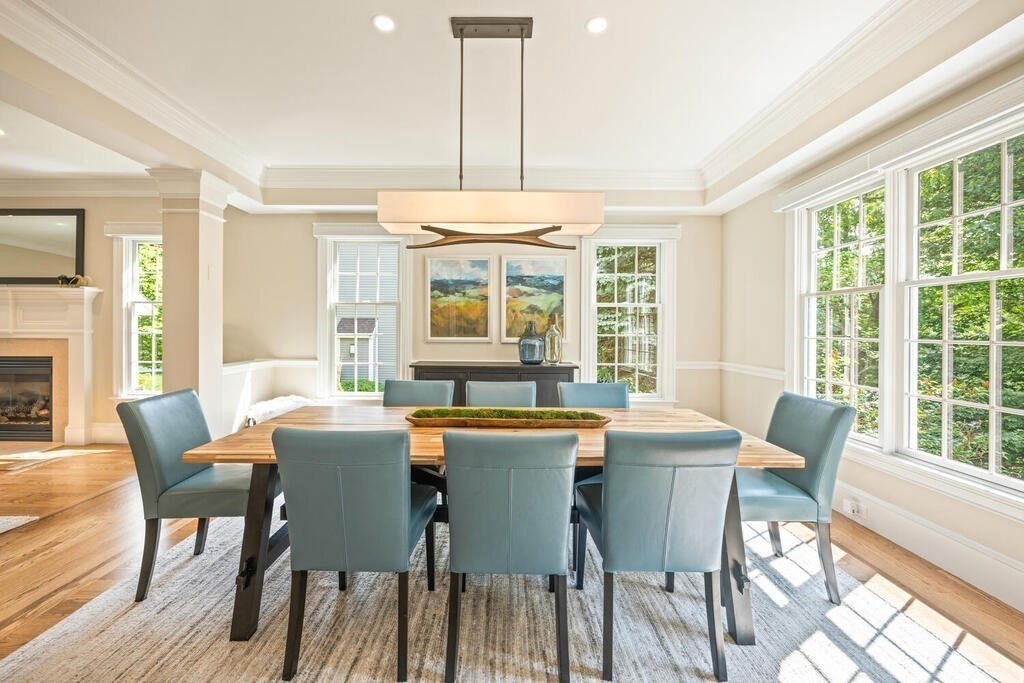23 Richard Road Lexington, MA 02421 - Photo 6 of 42 a dining room with furniture a chandelier and wooden floor