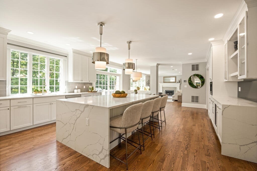 23 Richard Road Lexington, MA 02421 - Photo 7 of 42 a large kitchen with lots of counter space a sink appliances and a large window