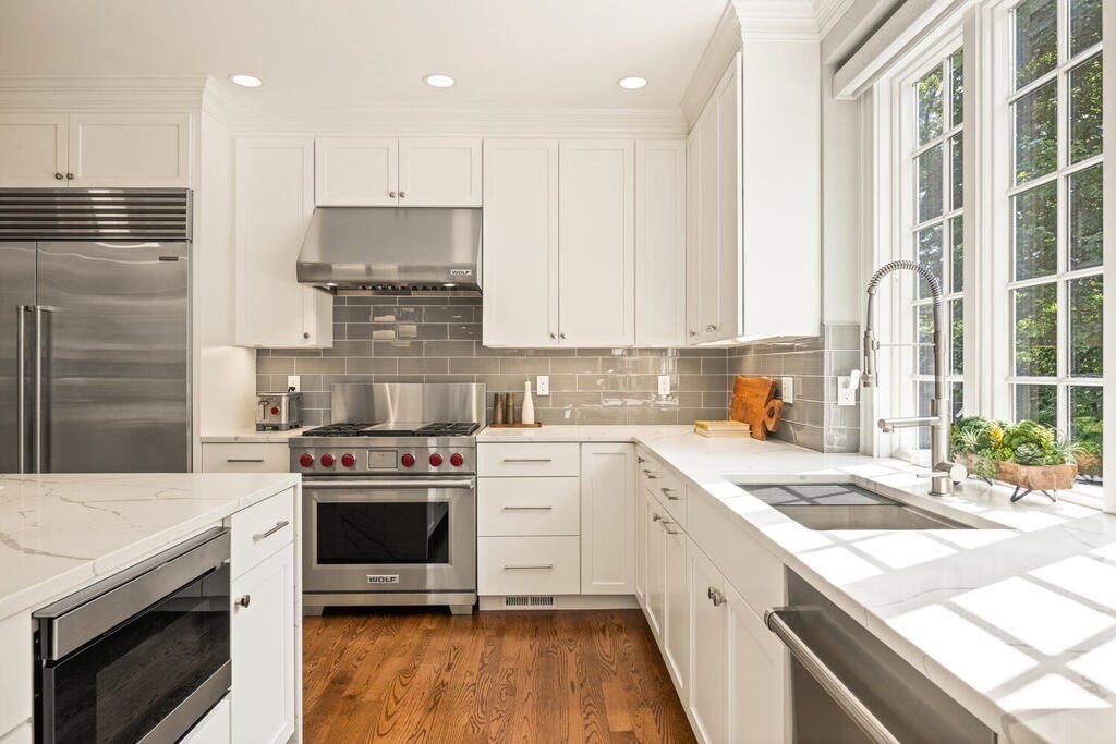 23 Richard Road Lexington, MA 02421 - Photo 9 of 42 a kitchen with a stove sink and cabinets