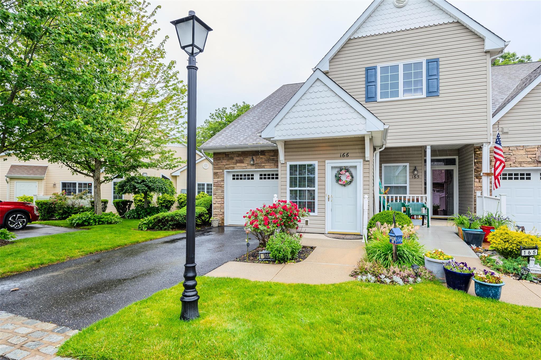 166 Ira Road Mount Sinai, NY 11766 - Photo 1 of 37 a front view of a house with a yard and a garden