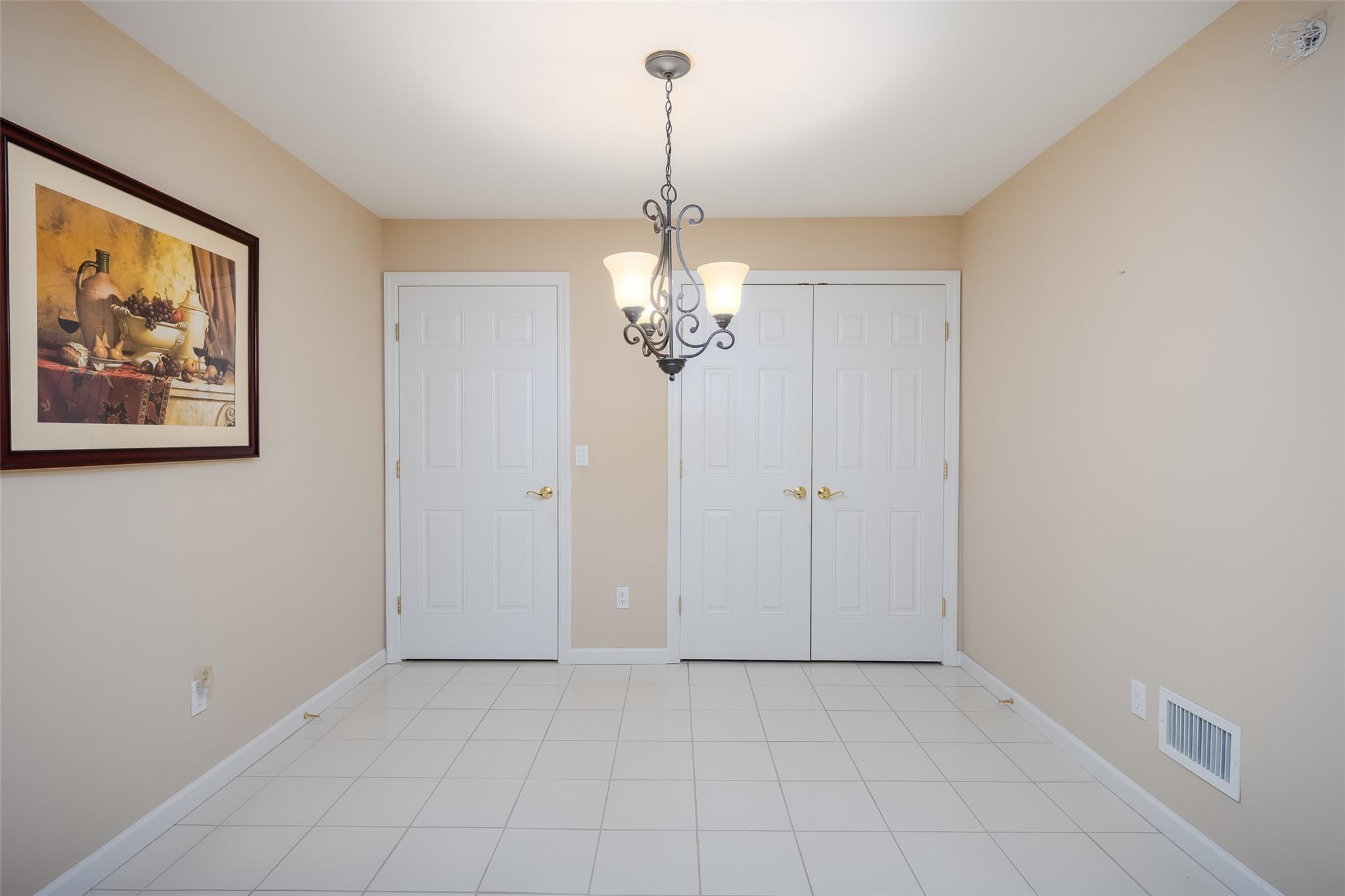 166 Ira Road Mount Sinai, NY 11766 - Photo 13 of 37 a view of a chandelier in a room