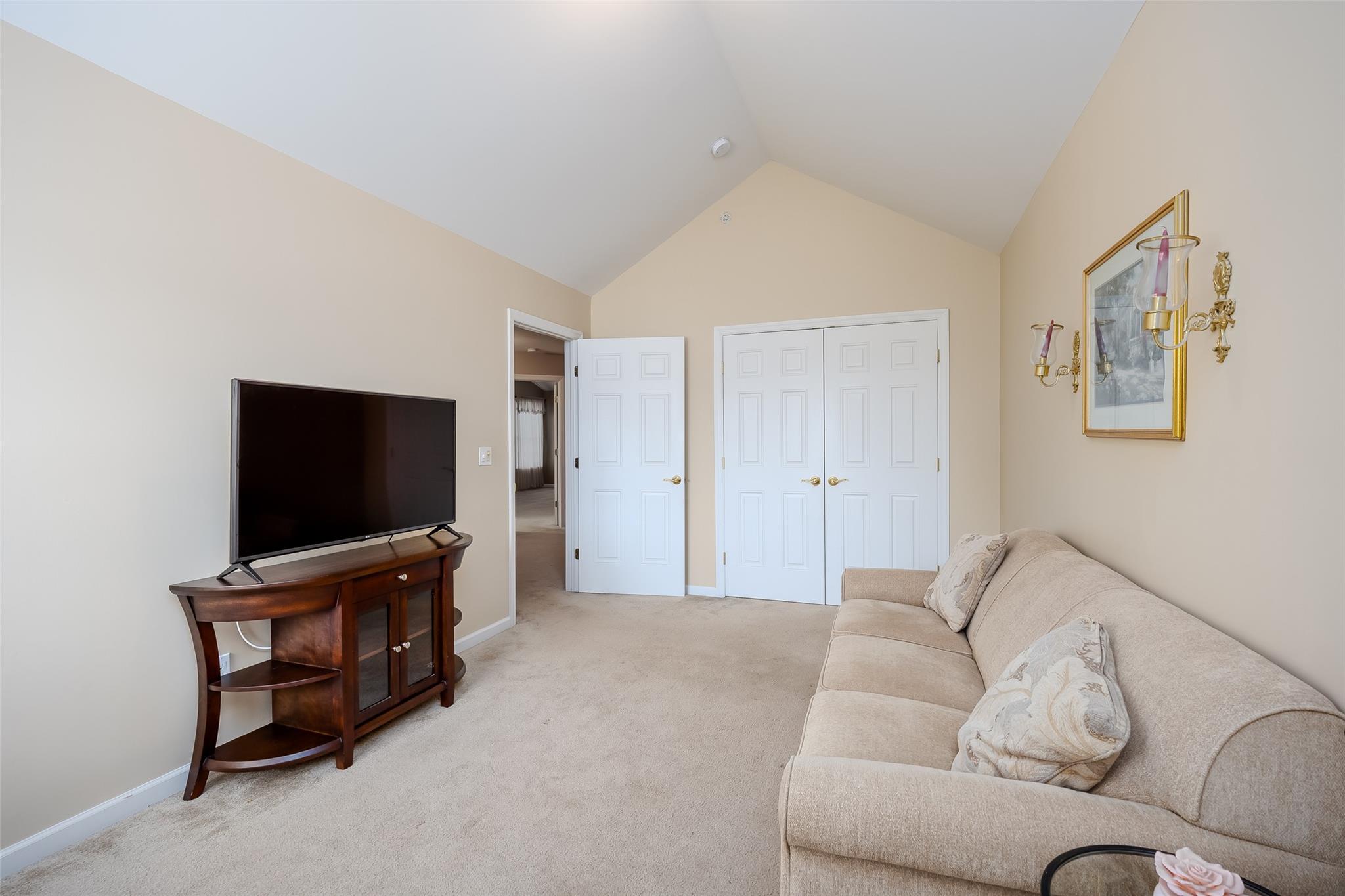 166 Ira Road Mount Sinai, NY 11766 - Photo 21 of 37 a living room with furniture and a flat screen tv