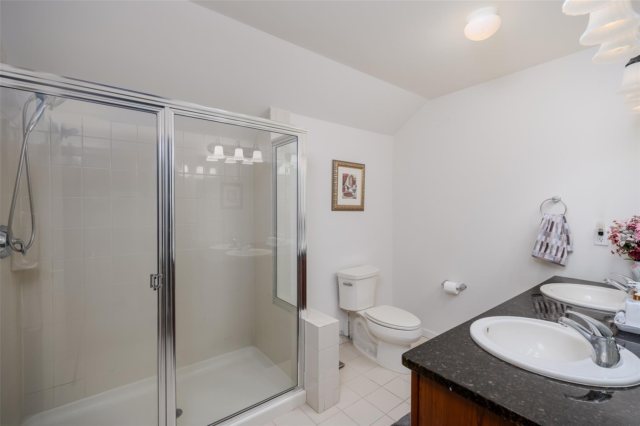 166 Ira Road Mount Sinai, NY 11766 - Photo 23 of 37 a bathroom with a granite countertop sink toilet and shower