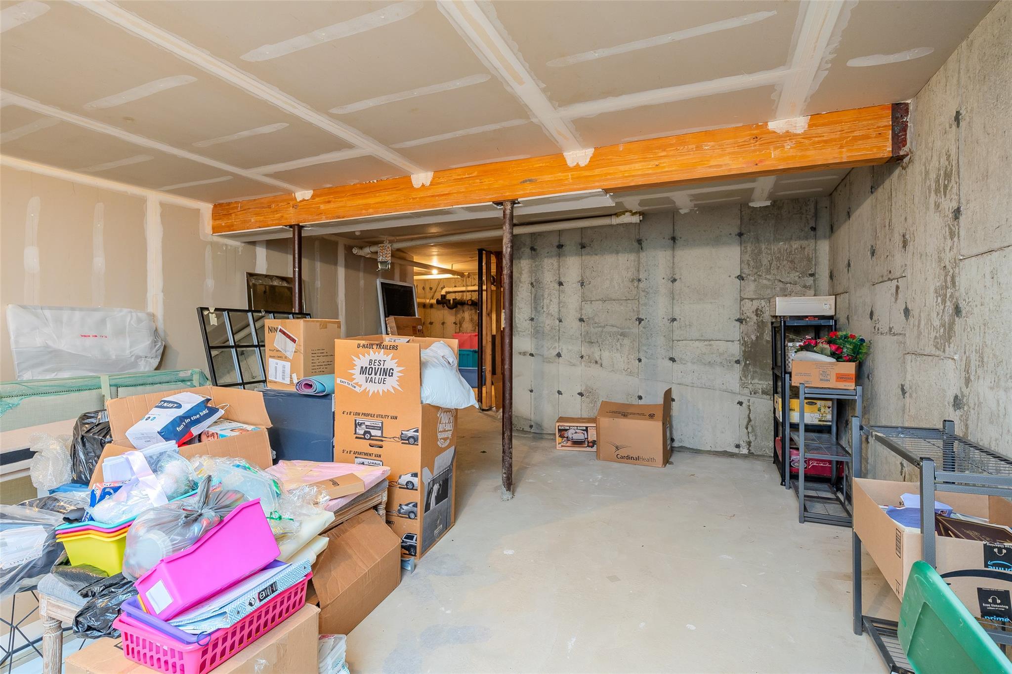 166 Ira Road Mount Sinai, NY 11766 - Photo 27 of 37 a storage room filled with furniture and a couch