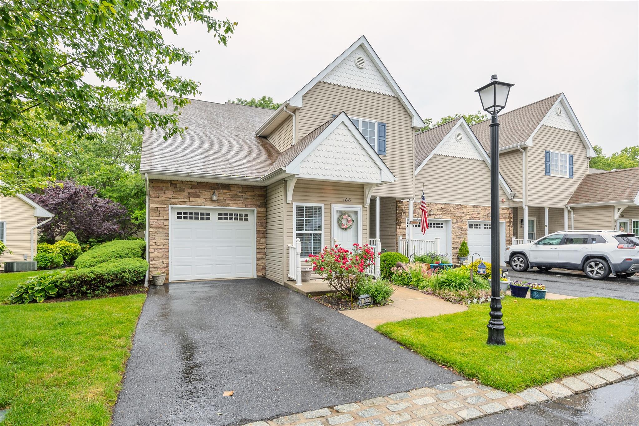 166 Ira Road Mount Sinai, NY 11766 - Photo 28 of 37 a front view of a house with garden
