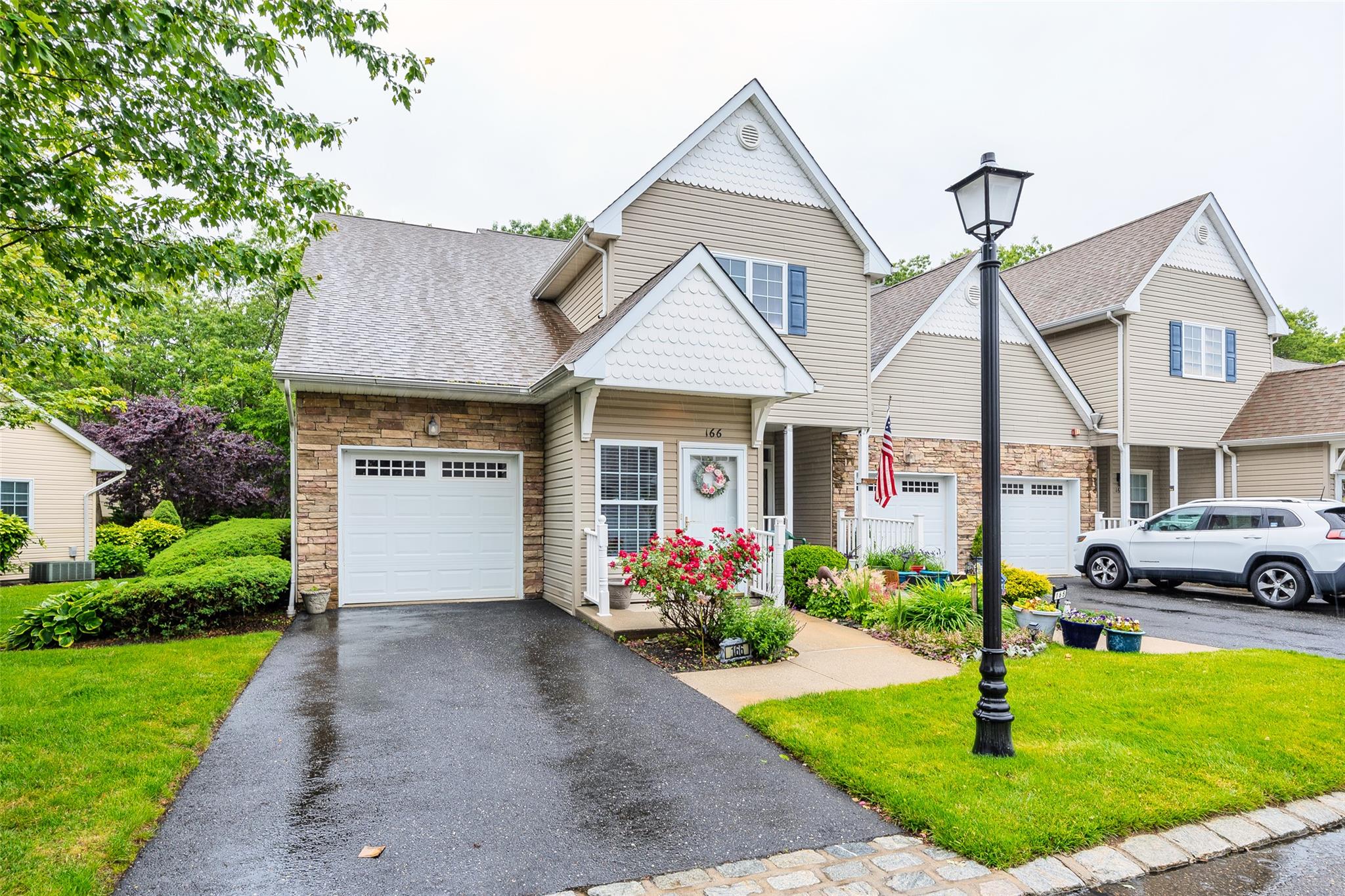166 Ira Road Mount Sinai, NY 11766 - Photo 29 of 37 a front view of a house with garden