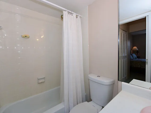 a view of a patio with dining table and chairs