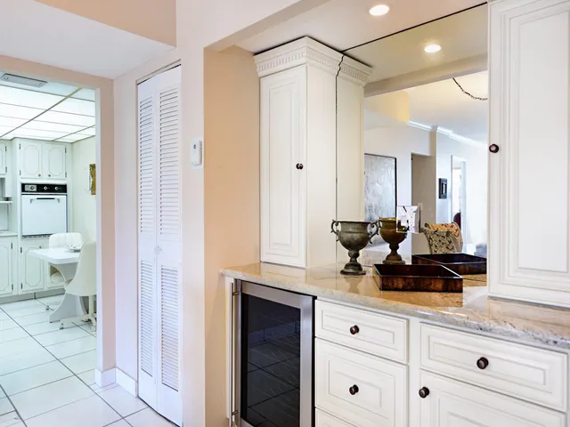 a bathroom with a double vanity sink a mirror and a shower