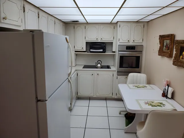 a kitchen with stainless steel appliances a refrigerator stove microwave and sink