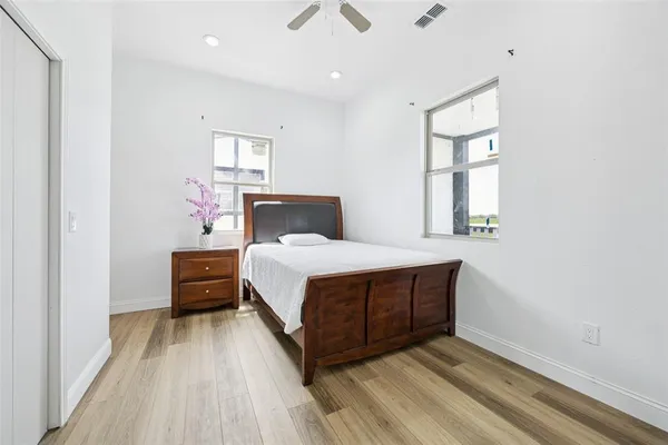 a bed room with a bed and a window