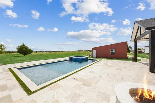 a view of an outdoor space and basketball court