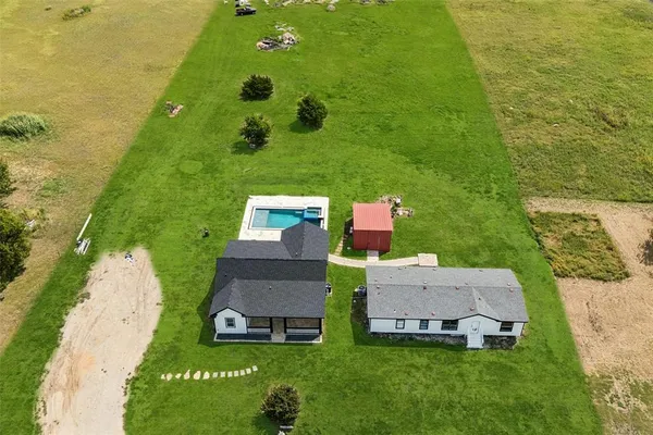 an aerial view of a house with a garden