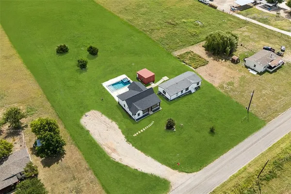 an aerial view of a house with a garden