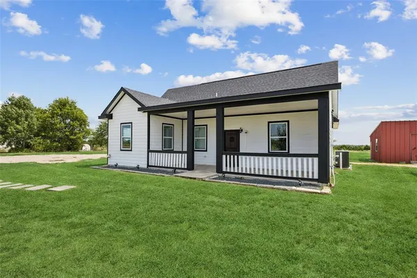 a backyard of a house with lots of green space