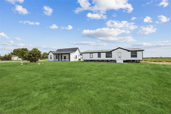 a front view of house with garden