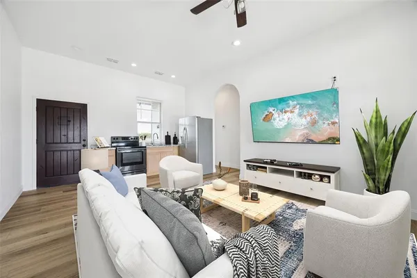 a living room with furniture and a flat screen tv