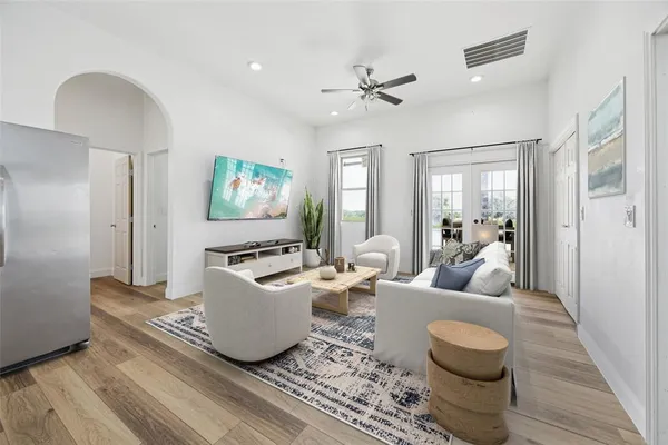 a living room with furniture and a flat screen tv