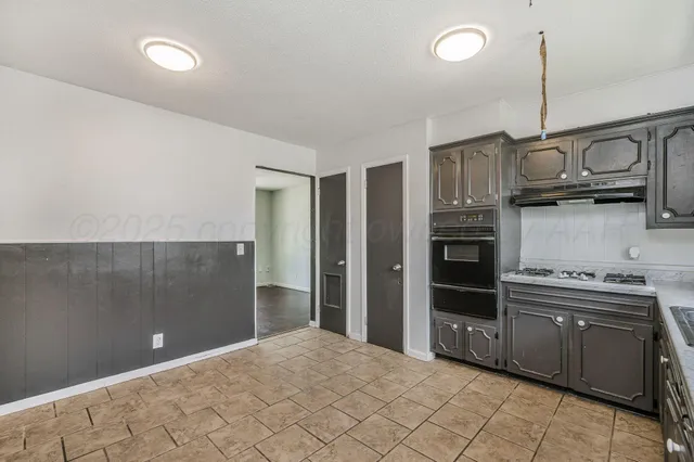 a large bathroom with a large tub and sink