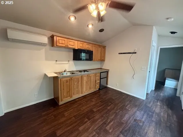 a view of a kitchen with a sink and a microwave