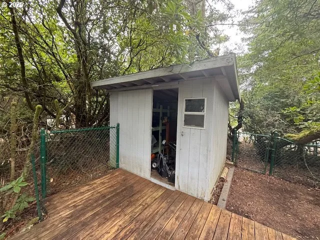 a view of an chairs and fire pit in the room