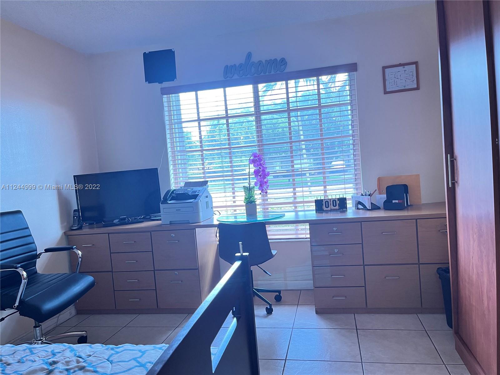 2520 Southwest 102nd Avenue Miami, FL 33165 - Photo 16 of 21 a kitchen with a sink and a window