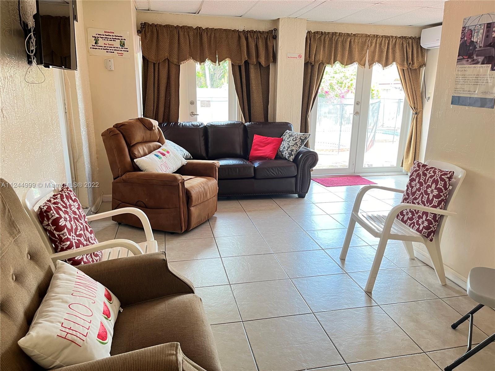 2520 Southwest 102nd Avenue Miami, FL 33165 - Photo 19 of 21 a living room with furniture and a large window