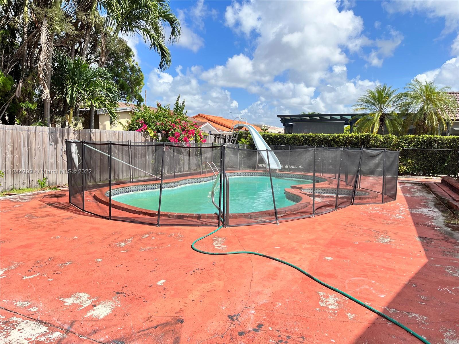 2520 Southwest 102nd Avenue Miami, FL 33165 - Photo 21 of 21 a park view with a bench and trees