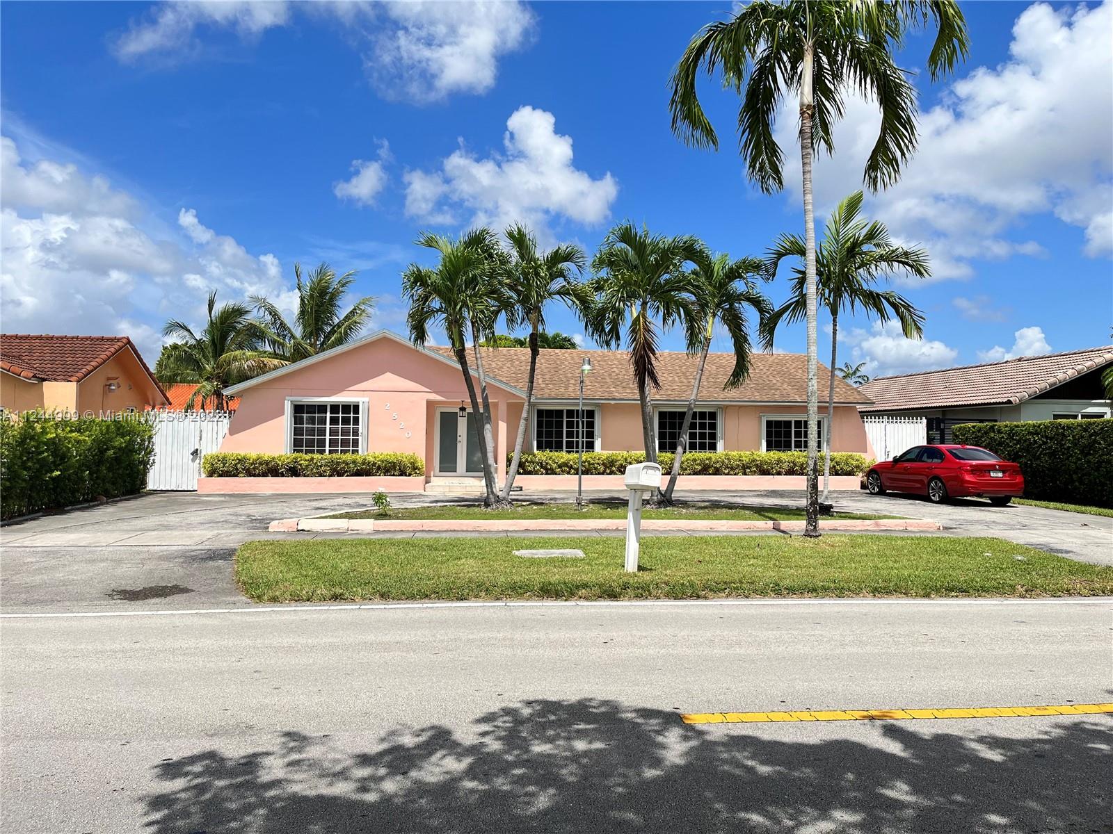2520 Southwest 102nd Avenue Miami, FL 33165 - Photo 3 of 21 a front view of a house with garden