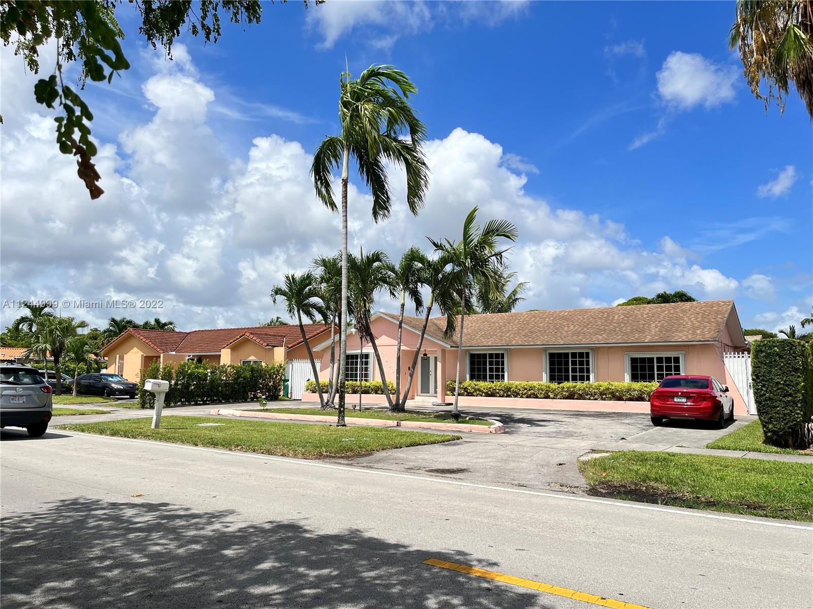 2520 Southwest 102nd Avenue Miami, FL 33165 - Photo 4 of 21 a view of multiple houses with a yard