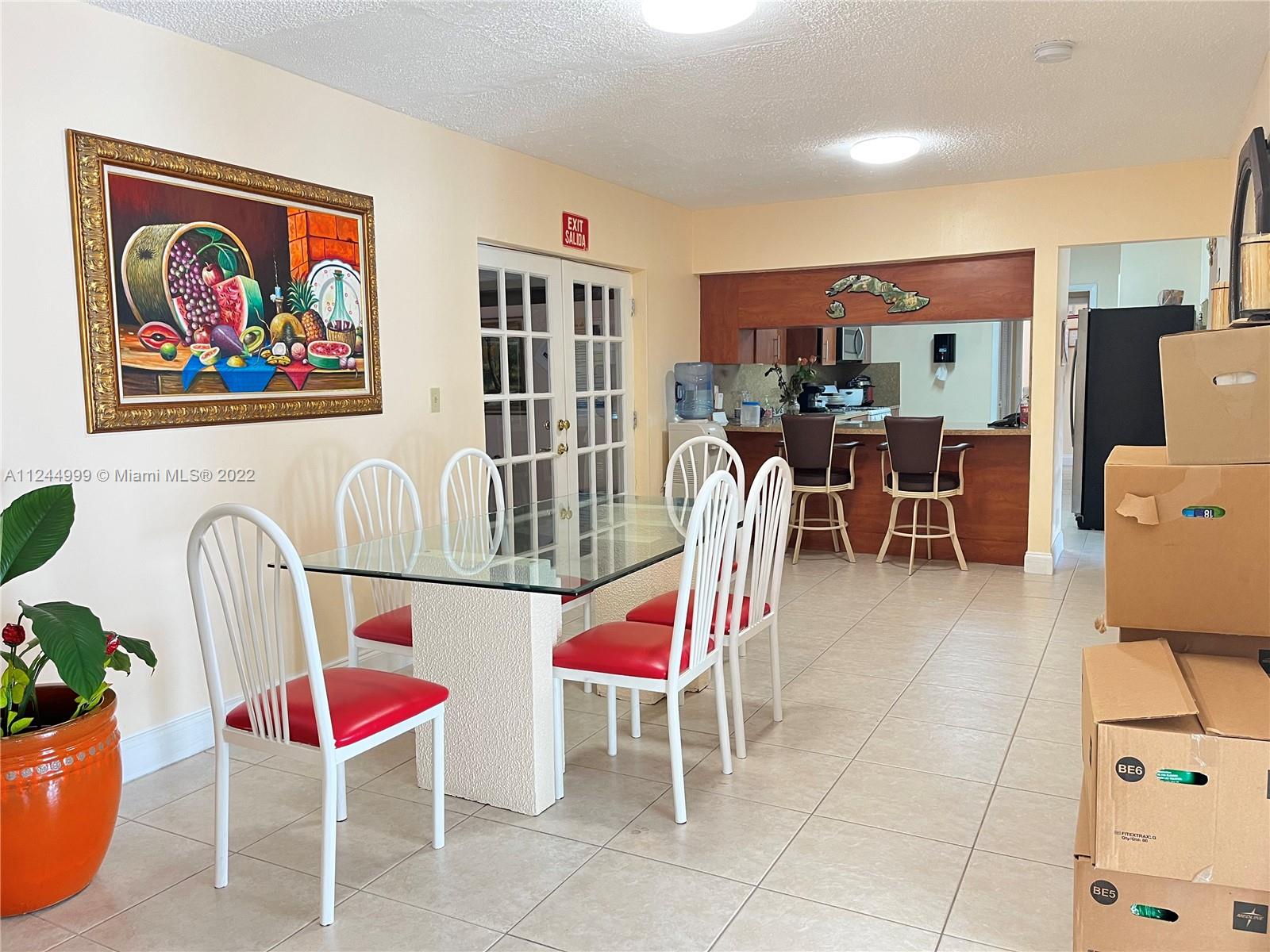 2520 Southwest 102nd Avenue Miami, FL 33165 - Photo 7 of 21 a living room with furniture a rug and white walls