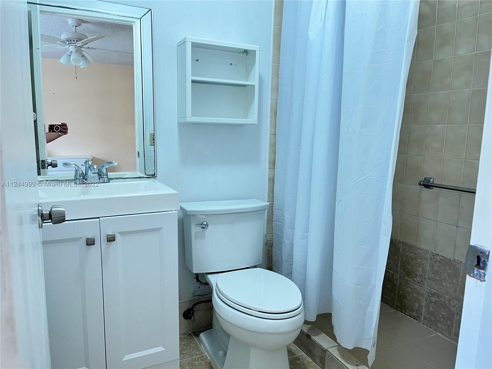 2520 Southwest 102nd Avenue Miami, FL 33165 - Photo 9 of 21 a bathroom with a sink a toilet and shower