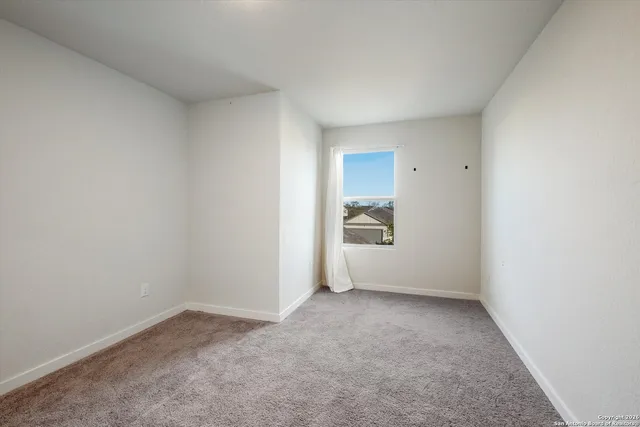 a view of an empty room and closet