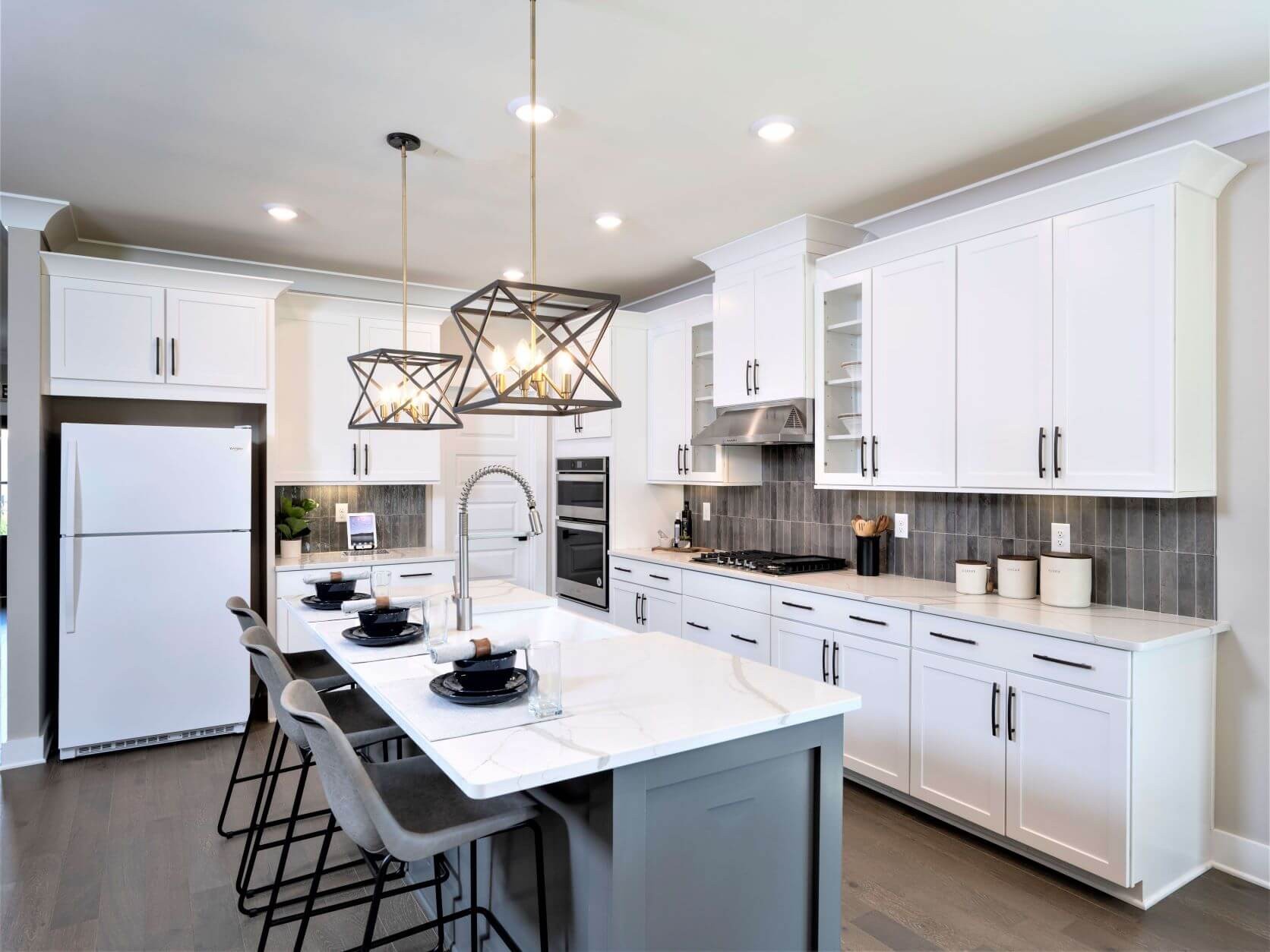 701 Castle Road Mount Juliet, TN 37122 - Photo 6 of 18 a kitchen with a sink a refrigerator and white cabinets