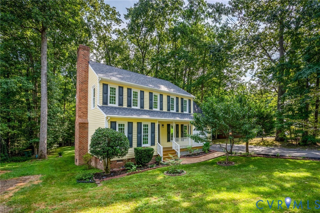 4820 Cedar Cliff Road Chester, VA 23831 - Photo 2 of 41 Two-story residence featuring light yellow siding,