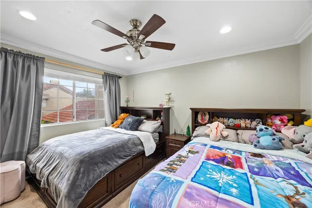 a bedroom with bed and a window